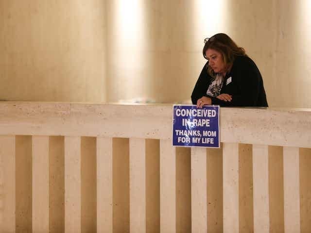 Pam Stenzel Holds Conceived in Rape Sign